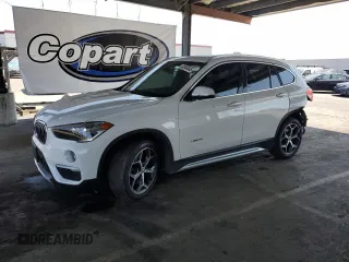 2017 BMW X1 xDrive28i with VIN WBXHT3C35H5F73546, listed as a Copart auction lot 59544545 with 125,185 mi miles and Salvage title. Bid and sale history available at DreamBid. Image 1.