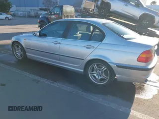 2003 BMW 3 Series 330i with VIN WBAEV53463KM29698, listed as a IAAI auction lot 41528947 with 204,400 mi miles. Bid and sale history available at carsss.com. Image 3.