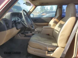 2000 Jeep Cherokee SE with VIN 1J4FF27S8YL173099, listed as a Copart auction lot 86200574 with 204,394 mi miles and Clean title. Bid and sale history available at DreamBid. Image 7.
