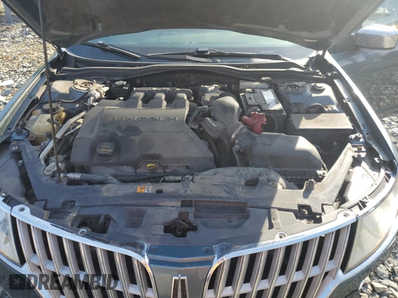 2012 Lincoln MKZ z VIN 3LNHL2GCXCR827302, wystawiony jako Copart lot #70519604 z przebiegiem 150 416 mil mil oraz Szkoda całkowita • Salvage title. Historia ofert i sprzedaży dostępna na DreamBid. Obrazek 11.