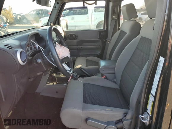 2010 Jeep Wrangler Unlimited Sahara with VIN 1J4BA5H17AL123479, listed as a Copart auction lot 49066315 with 114,419 mi miles and Salvage Title. Bid and sale history available at carsss.com. Image 7.