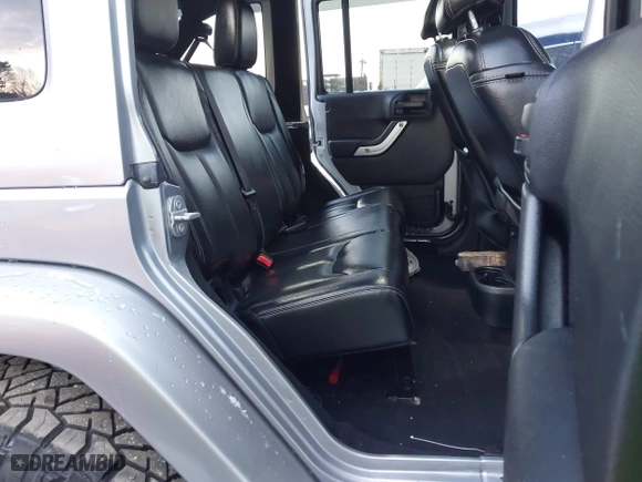 2015 Jeep Wrangler Unlimited Rubicon Hard Rock with VIN 1C4HJWFG1FL659803, listed as a IAAI auction lot 41172485 with 126,881 mi miles. Bid and sale history available at carsss.com. Image 8.