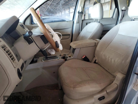2008 Ford Escape Hybrid with VIN 1FMCU49H98KA28845, listed as a Copart auction lot 52648135 with 210,756 mi miles and Salvage title. Bid and sale history available at DreamBid. Image 7.