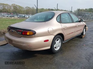 1997 Ford Taurus GL z VIN 1FALP52U2VA273762, wystawiony jako IAAI lot #41956536 z przebiegiem 177 340 mil mil oraz . Historia ofert i sprzedaży dostępna na DreamBid. Obrazek 4.