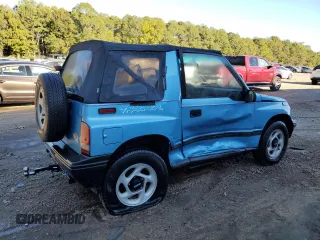 1995 Geo Tracker z VIN 2CNBE18U4S6948656, wystawiony jako Copart lot #76087194 z przebiegiem 163 080 mil mil oraz Szkody całkowita. Historia ofert i sprzedaży dostępna na DreamBid. Obrazek 3.