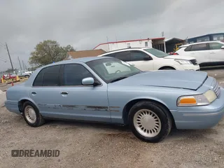 1999 Ford Crown Victoria z VIN 2FAFP73WXXX221069, wystawiony jako IAAI lot #41750127 z przebiegiem 177 142 mil mil oraz . Historia ofert i sprzedaży dostępna na DreamBid. Obrazek 13.