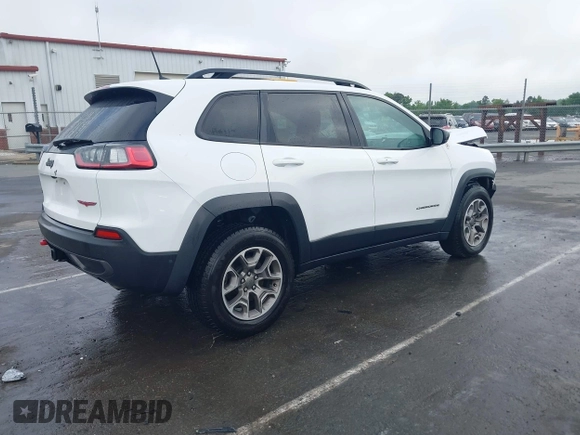 2022 Jeep Cherokee Trailhawk with VIN 1C4PJMBX1ND500729, listed as a IAAI auction lot 42235098 with 60,354 mi miles and . Bid and sale history available at DreamBid. Image 4.