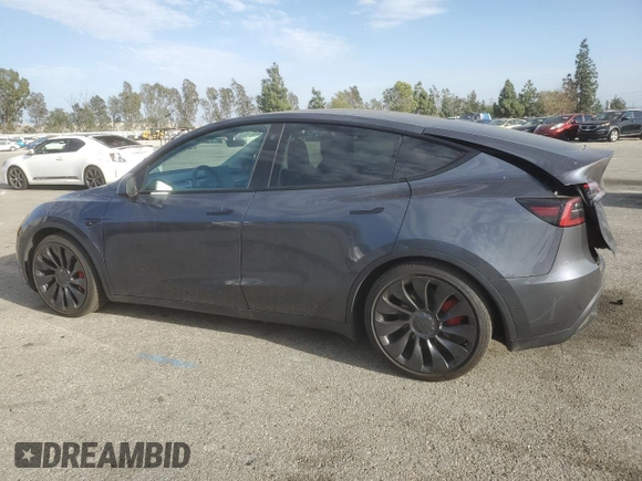 2022 Tesla Model Y Performance with VIN 7SAYGDEF3NF490643, listed as a Copart auction lot 46975825 with 50,792 mi miles and Salvage Title. Bid and sale history available at DreamBid. Image 2.
