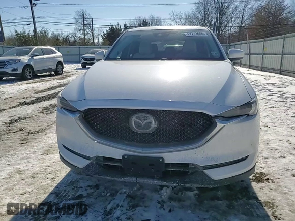 2021 Mazda CX-5 Grand Touring with VIN JM3KFBDM3M1305807, listed as a Copart auction lot 42713655 with 58,162 mi miles and Salvage Title. Bid and sale history available at DreamBid. Image 11.