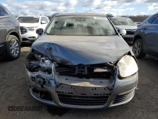 2009 Volkswagen Jetta z VIN 3VWHZ71KX9M011693, wystawiony jako Copart lot #87076904 z przebiegiem 157 478 mil mil oraz Szkoda całkowita • Salvage title. Historia ofert i sprzedaży dostępna na DreamBid. Obrazek 5.