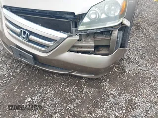 2007 Honda Odyssey EX-L z VIN 5FNRL38717B102646, wystawiony jako IAAI lot #42380196 z przebiegiem 234 088 mil mil oraz . Historia ofert i sprzedaży dostępna na DreamBid. Obrazek 6.