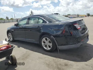 2015 Ford Taurus SE with VIN 1FAHP2D86FG140750, listed as a Copart auction lot 54390145 with 128,163 mi miles and Salvage Title. Bid and sale history available at carsss.com. Image 2.