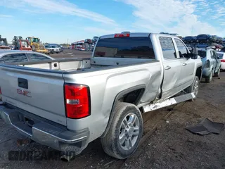 2015 GMC Sierra 2500HD available WiFi SLT with VIN 1GT12ZEG7FF167096, listed as a IAAI auction lot 41408317 with 152,969 mi miles. Bid and sale history available at carsss.com. Image 4.