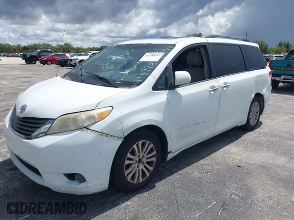 2014 Toyota Sienna XLE with VIN 5TDYK3DC4ES414728, listed as a IAAI auction lot 42588916 with 291,007 mi miles and . Bid and sale history available at DreamBid. Image 2.