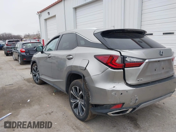 2021 Lexus RX with VIN 2T2HZMDA4MC305057, listed as a IAAI auction lot 41706486 with 37,518 mi miles. Bid and sale history available at carsss.com. Image 3.