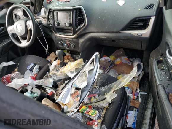 2016 Jeep Cherokee Sport with VIN 1C4PJLAB0GW189379, listed as a Copart auction lot 52239555 with 142,699 mi miles and Salvage title. Bid and sale history available at DreamBid. Image 8.