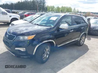 2012 Kia Sorento SX with VIN 5XYKWDA26CG258262, listed as a IAAI auction lot 42068704 with 124,832 mi miles. Bid and sale history available at carsss.com. Image 2.