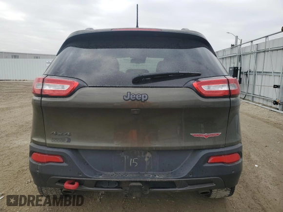 2015 Jeep Cherokee Trailhawk with VIN 1C4PJMBS0FW678738, listed as a Copart auction lot 50651235 with 147,793 mi miles and Salvage title. Bid and sale history available at DreamBid. Image 6.