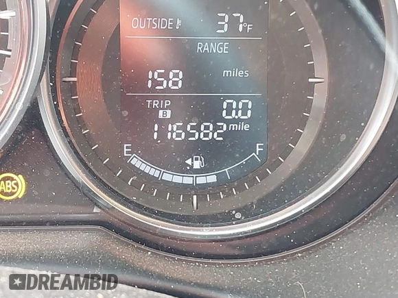 2015 Mazda CX-5 Grand Touring with VIN JM3KE4DY2F0477966, listed as a IAAI auction lot 41247178 with 116,582 mi miles. Bid and sale history available at carsss.com. Image 16.