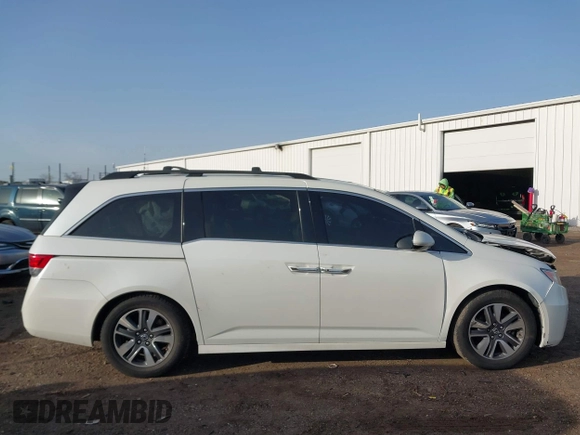 2014 Honda Odyssey Touring with VIN 5FNRL5H97EB037358, listed as a IAAI auction lot 41832825 with 208,894 mi miles and . Bid and sale history available at DreamBid. Image 13.