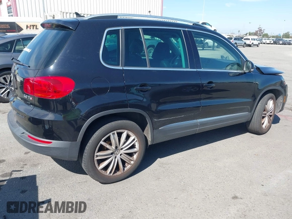 2015 Volkswagen Tiguan SE with VIN WVGAV7AX5FW509612, listed as a IAAI auction lot 42020599 with 64,201 mi miles and . Bid and sale history available at DreamBid. Image 4.