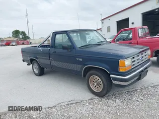 1990 Ford Ranger XLT z VIN 1FTCR10X1LPB26207, wystawiony jako IAAI lot #42306083 z przebiegiem 39 173 mil mil oraz . Historia ofert i sprzedaży dostępna na DreamBid. Obrazek 1.