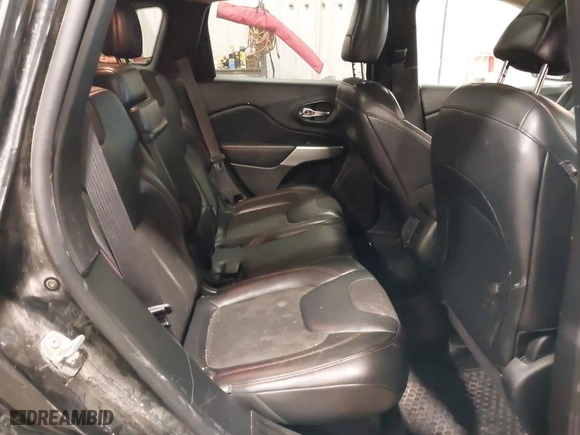 2017 Jeep Cherokee Trailhawk with VIN 1C4PJMBS8HW648454, listed as a IAAI auction lot 41094103 with 125,941 mi miles. Bid and sale history available at carsss.com. Image 8.
