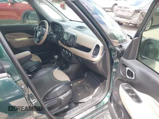 2014 FIAT 500L Lounge z VIN ZFBCFACH7EZ023283, wystawiony jako IAAI lot #42319623 z przebiegiem 129 414 mil mil oraz . Historia ofert i sprzedaży dostępna na DreamBid. Obrazek 5.
