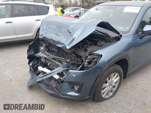 2015 Mazda CX-5 Touring with VIN JM3KE4CY1F0545305, listed as a IAAI auction lot 41234599 with 92,791 mi miles. Bid and sale history available at carsss.com. Image 17.