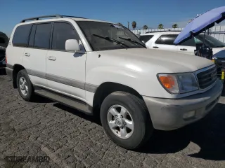 1999 Toyota Land Cruiser with VIN JT3HT05J0X0059222, listed as a Copart auction lot 77713294 with 406,869 mi miles and Clean Title. Bid and sale history available at carsss.com. Image 4.