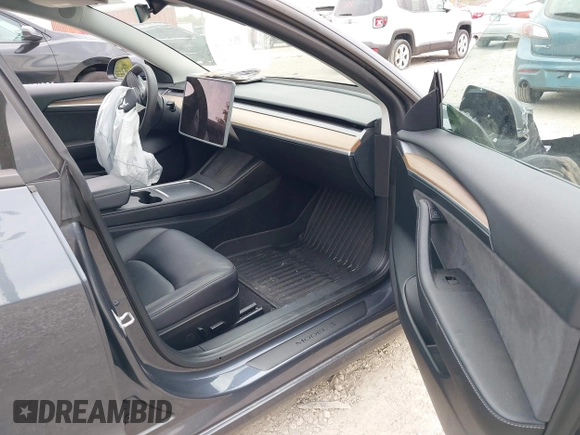 2023 Tesla Model 3 z VIN 5YJ3E1EA3PF699724, wystawiony jako IAAI lot #40654814 z przebiegiem Nie podano mil oraz . Historia ofert i sprzedaży dostępna na DreamBid. Obrazek 5.
