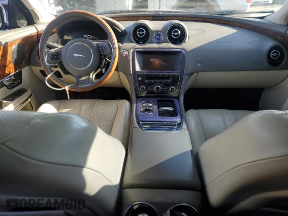 2012 Jaguar XJ with VIN SAJWA1CB3CLV37685, listed as a Copart auction lot 87586005 with 59,885 mi miles and Salvage title. Bid and sale history available at DreamBid. Image 8.