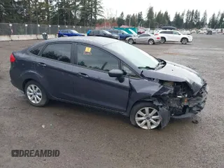 2012 Ford Fiesta SE with VIN 3FADP4BJXCM216102, listed as a IAAI auction lot 41903721 with 125,760 mi miles. Bid and sale history available at carsss.com. Image 1.