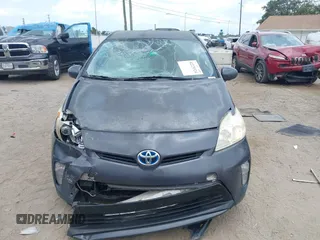 2012 Toyota Prius One z VIN JTDKN3DU0C1592300, wystawiony jako IAAI lot #42225324 z przebiegiem 171 746 mil mil oraz . Historia ofert i sprzedaży dostępna na DreamBid. Obrazek 6.