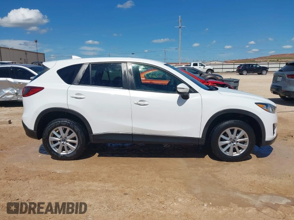 2016 Mazda CX-5 Touring z VIN JM3KE2CY0G0840918, wystawiony jako IAAI lot #42205529 z przebiegiem 74 515 mil mil oraz . Historia ofert i sprzedaży dostępna na DreamBid. Obrazek 13.
