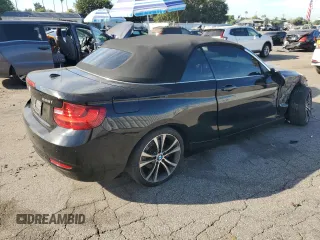 2015 BMW 2 Series 228i with VIN WBA1K5C59FV242992, listed as a Copart auction lot 75433654 with Not provided miles and Salvage title. Bid and sale history available at DreamBid. Image 3.