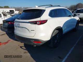 2021 Mazda CX-9 Touring with VIN JM3TCACY4M0522302, listed as a IAAI auction lot 41323543 with 35,223 mi miles and . Bid and sale history available at DreamBid. Image 4.