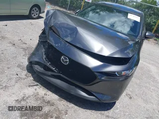 2022 Mazda 3 Select z VIN JM1BPAKL1N1519383, wystawiony jako IAAI lot #39742243 z przebiegiem 20 080 mil mil oraz . Historia ofert i sprzedaży dostępna na DreamBid. Obrazek 6.
