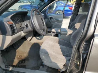 1999 Jeep Grand Cherokee Laredo with VIN 1J4G258S9XC731752, listed as a Copart auction lot 58601555 with 245,284 mi miles and Salvage title. Bid and sale history available at DreamBid. Image 7.