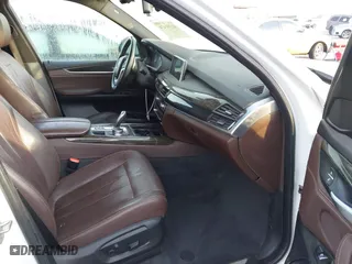 2018 BMW X5 xDrive40e iPerformance with VIN 5UXKT0C58J0V99415, listed as a IAAI auction lot 41391474 with 124,671 mi miles. Bid and sale history available at carsss.com. Image 5.
