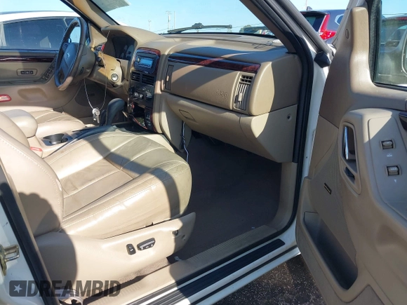 2001 Jeep Grand Cherokee Limited with VIN 1J4GW58S41C615418, listed as a IAAI auction lot 42141143 with 148,145 mi miles. Bid and sale history available at carsss.com. Image 5.