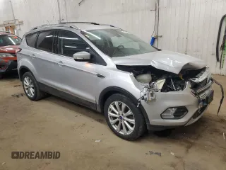 2017 Ford Escape Titanium with VIN 1FMCU0JD6HUE70200, listed as a Copart auction lot 49141595 with 92,159 mi miles and Salvage Title. Bid and sale history available at DreamBid. Image 4.