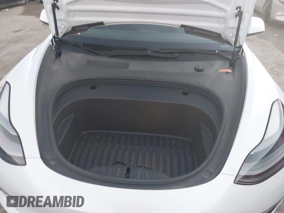 2021 Tesla Model 3 Standard Range Plus z VIN 5YJ3E1EA3MF043860, wystawiony jako IAAI lot #41214748 z przebiegiem 32 753 mil mil oraz . Historia ofert i sprzedaży dostępna na DreamBid. Obrazek 10.