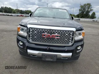 2020 GMC Canyon 4WD Denali with VIN 1GTG6EEN0L1243031, listed as a Copart auction lot 67939014 with 106,294 mi miles and Salvage Title. Bid and sale history available at carsss.com. Image 5.