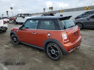 2013 MINI Hardtop S with VIN WMWSV3C57DT477948, listed as a Copart auction lot 54437155 with 63,114 mi miles and Salvage Title. Bid and sale history available at DreamBid. Image 2.