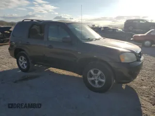 2006 Mazda Tribute S with VIN 4F2YZ04116KM23873, listed as a Copart auction lot 79926084 with 67,142 mi miles and Salvage Title. Bid and sale history available at DreamBid. Image 4.