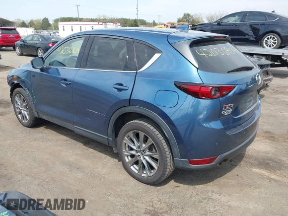 2019 Mazda CX-5 Signature with VIN JM3KFBEY1K0512880, listed as a IAAI auction lot 42036904 with 92,650 mi miles. Bid and sale history available at carsss.com. Image 3.