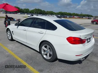 2015 BMW 4 Series 428i xDrive with VIN WBA4C9C56FG135520, listed as a IAAI auction lot 41574336 with 70,870 mi miles and . Bid and sale history available at carsss.com. Image 3.