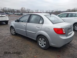2010 Kia Rio LX with VIN KNADH4A37A6645279, listed as a IAAI auction lot 40856780 with 165,385 mi miles. Bid and sale history available at carsss.com. Image 3.