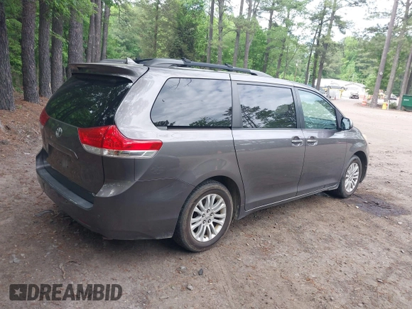 2011 Toyota Sienna XLE AAS with VIN 5TDYK3DC8BS016319, listed as a IAAI auction lot 42186294 with 293,401 mi miles and . Bid and sale history available at DreamBid. Image 4.
